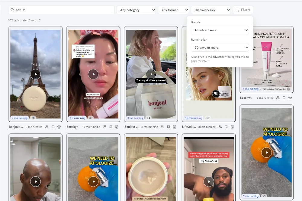 The ad library: search, filters, and a masonry grid of ads with their run length.